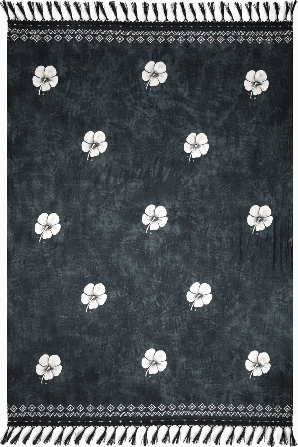 Black Sarong with white floral patterns and fringe.