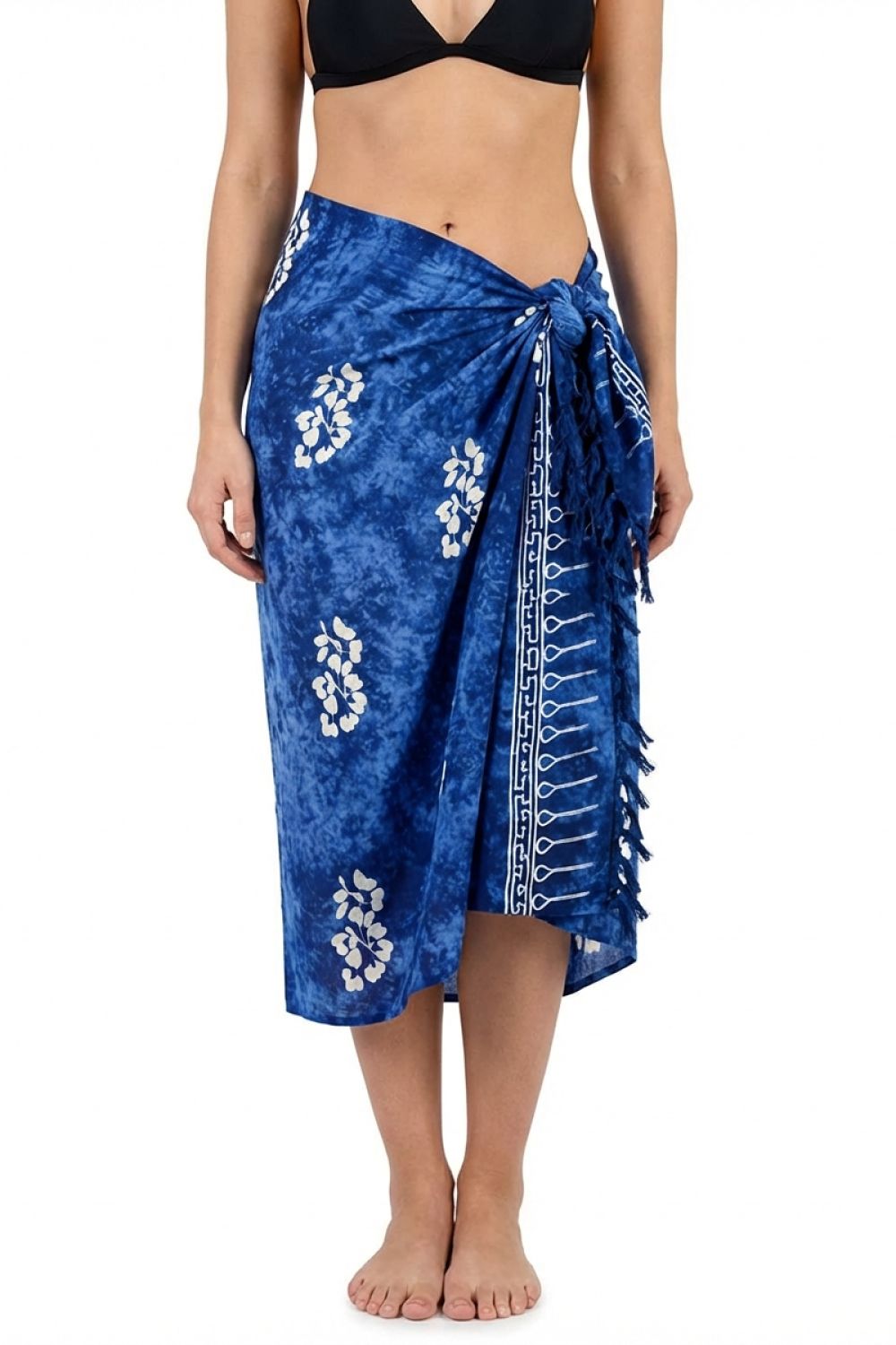 Woman wearing a blue floral sarong on a white background