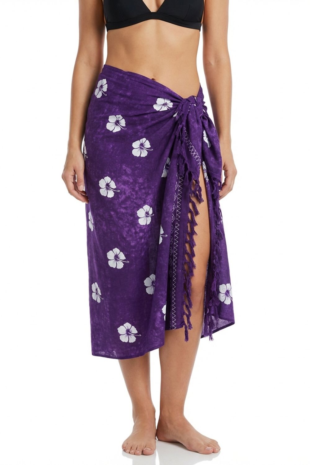 Woman wearing a batik hibiscus print sarong