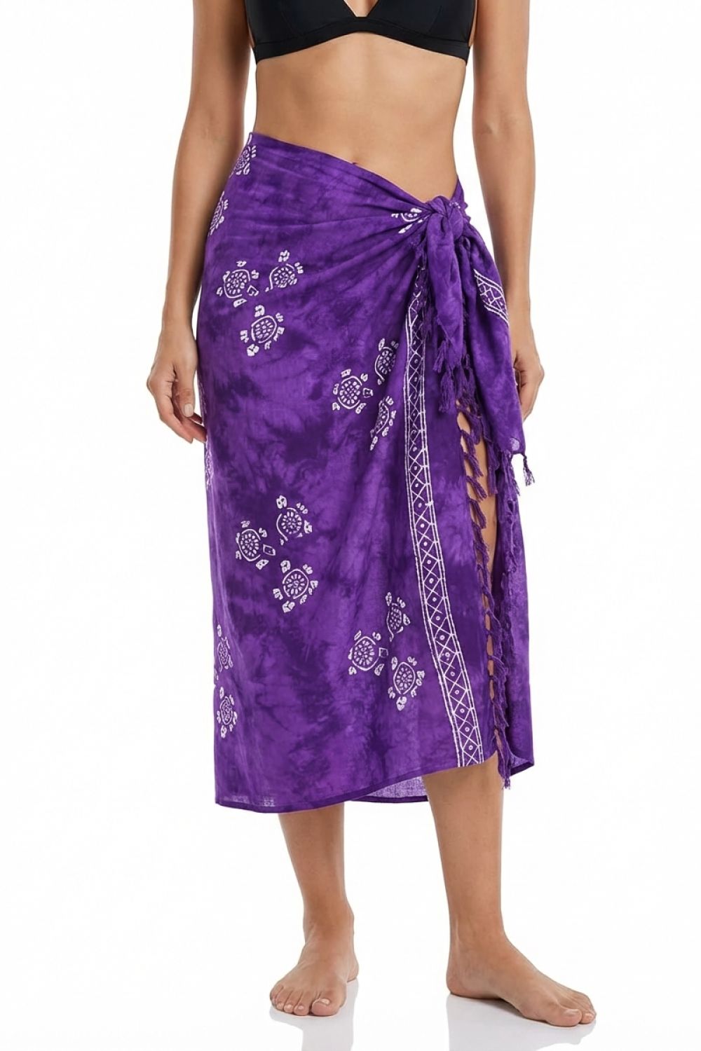 Purple sarong with turtle pattern worn by a person on a white background