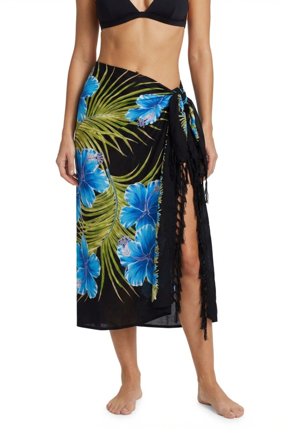 Woman wearing a tropical floral sarong with a black background