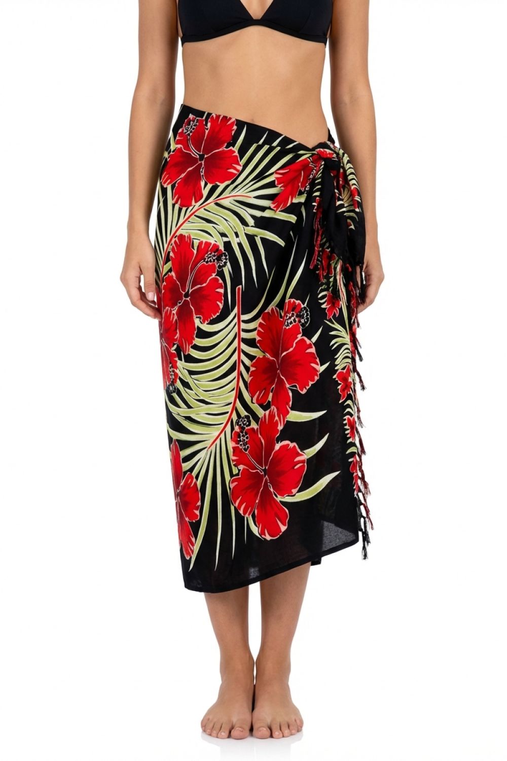 Tropical floral sarong with red flowers and green leaves on a black background