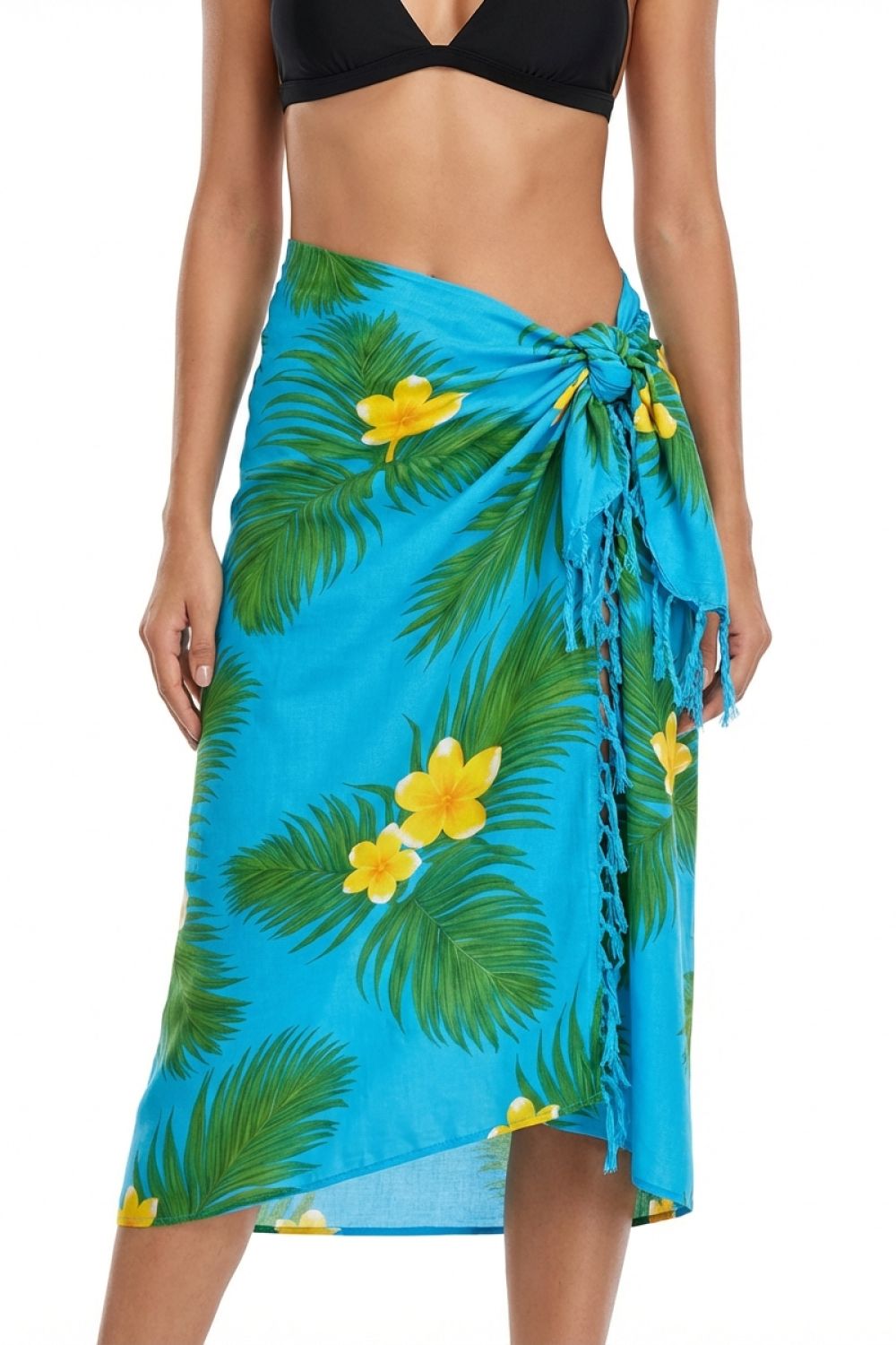 Blue tropical print sarong with yellow flowers worn by a person on a white background