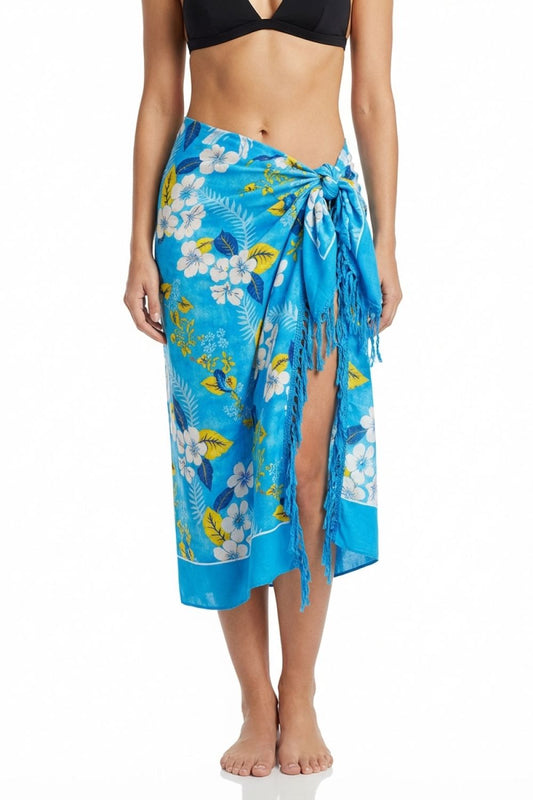 Woman wearing a blue floral sarong on a white background