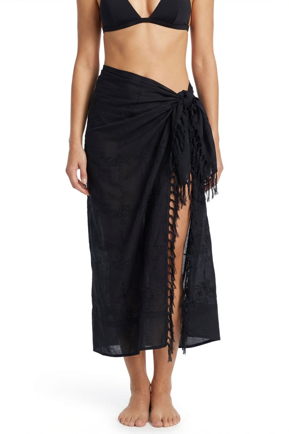 Black sarong with lace-up sides worn by a person on a white background