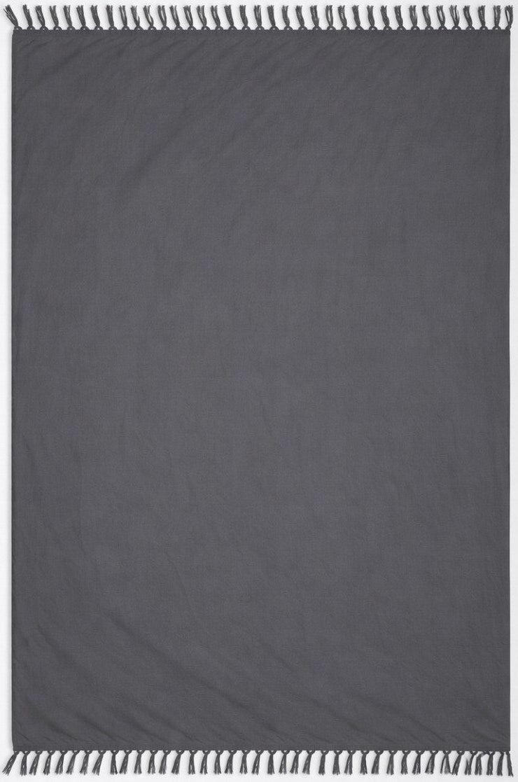 Dark gray sarong with white trim on a plain background
