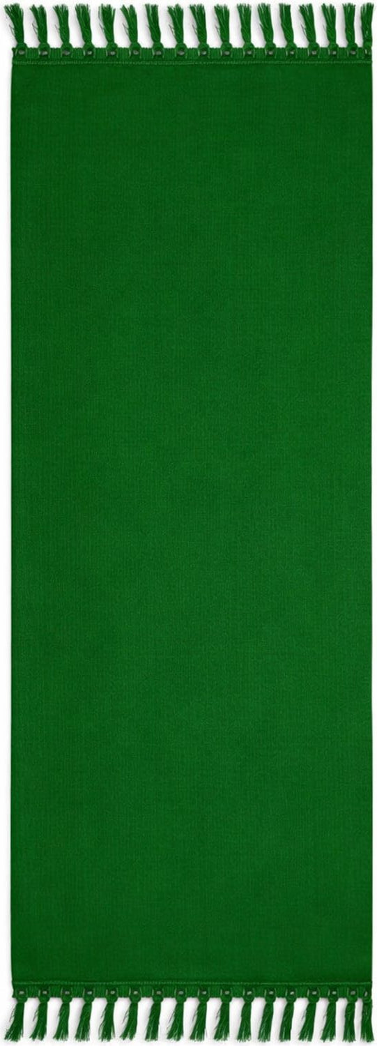 Green  sarong with fringe on a plain background