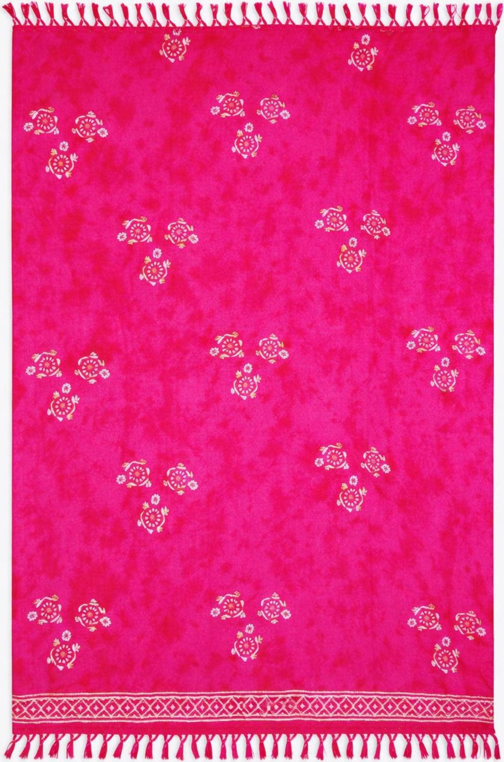 Pink sarong with white turtle patterns and fringed edges