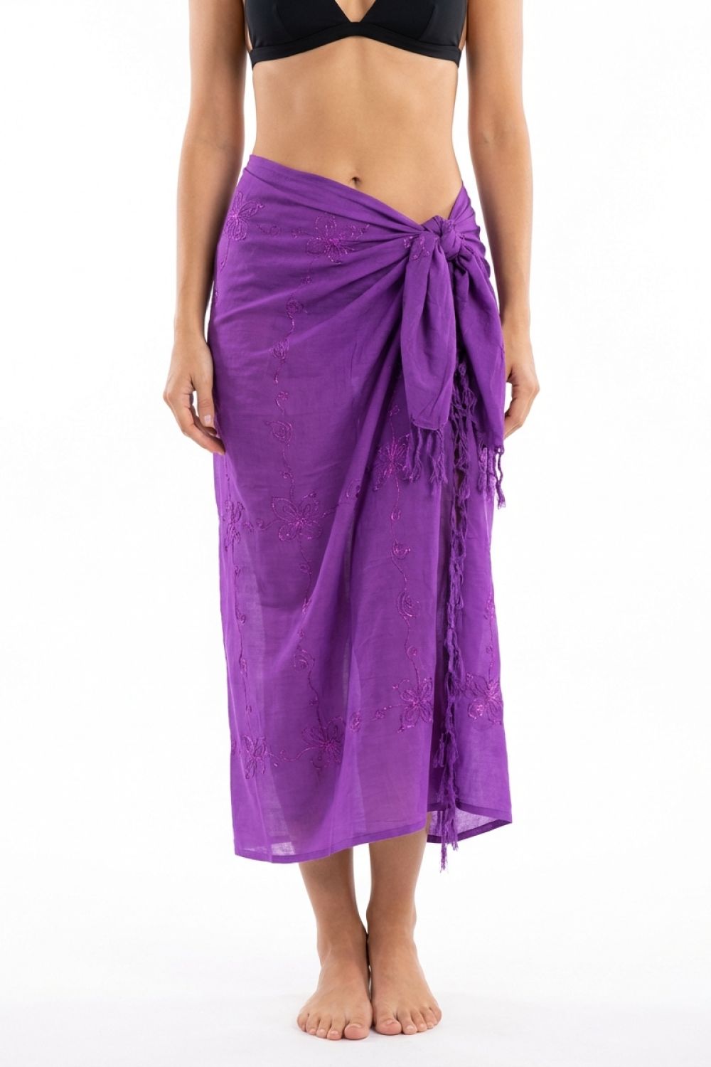Purple sarong worn by a person on a white background