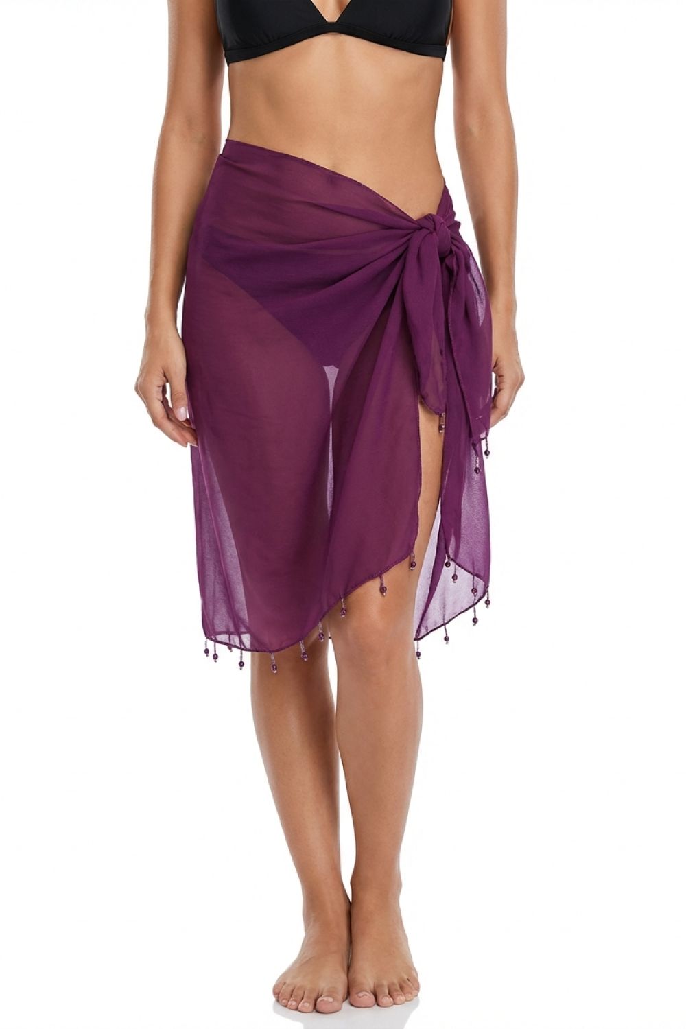 Purple sarong being worn by a person on a white background