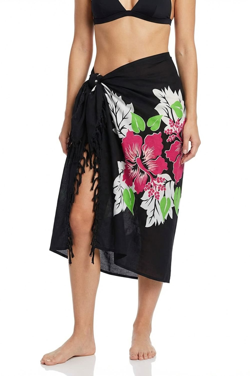 Black floral sarong with pink flowers and green leaves worn by a person on a white background