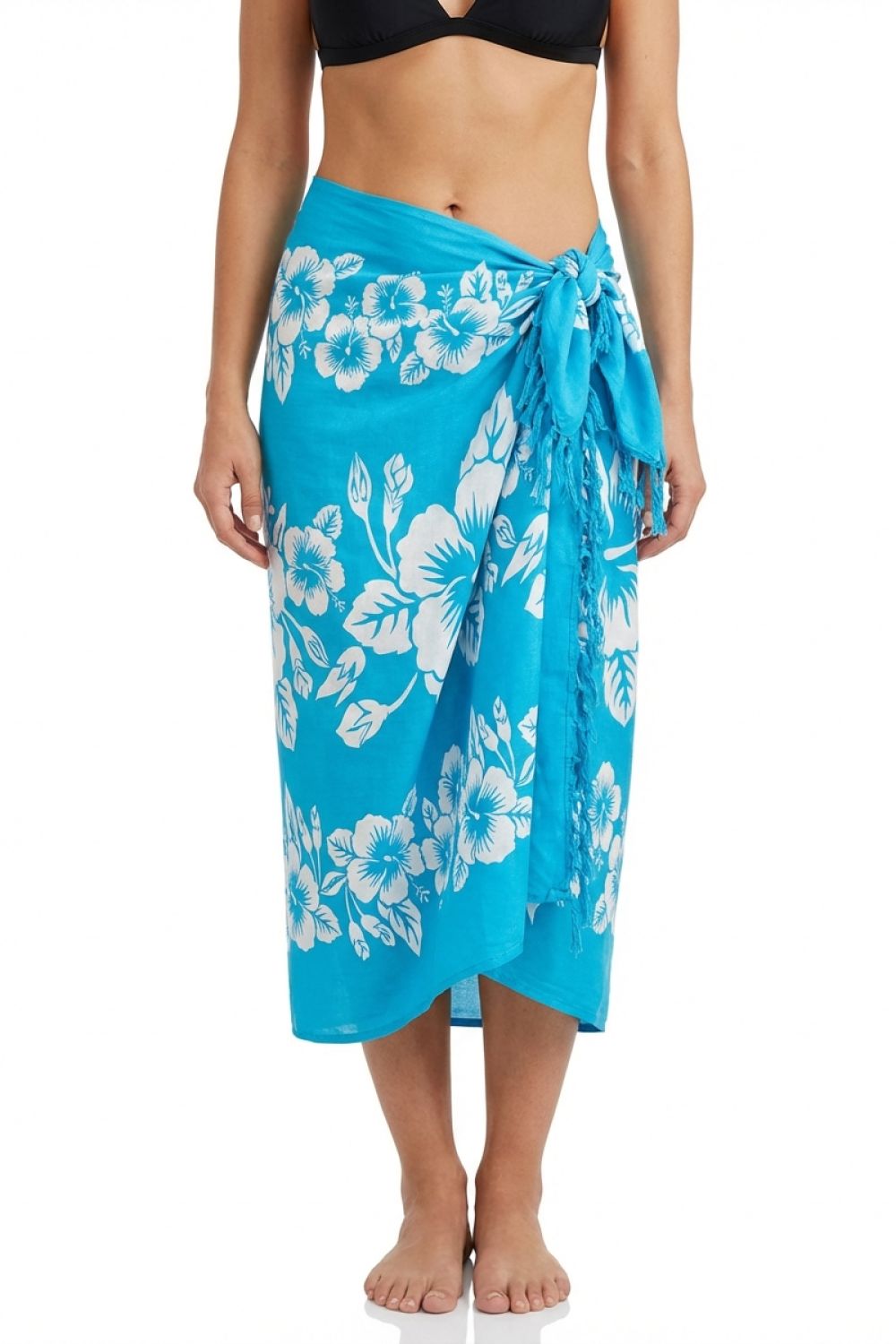 Woman wearing a blue floral sarong on a white background