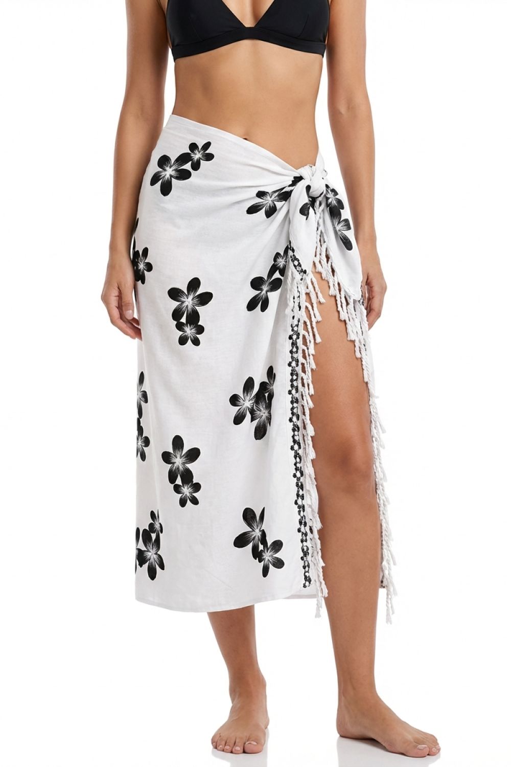 White sarong with black floral patterns on a white background